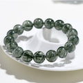 Greenstone beaded bracelet on a white plate