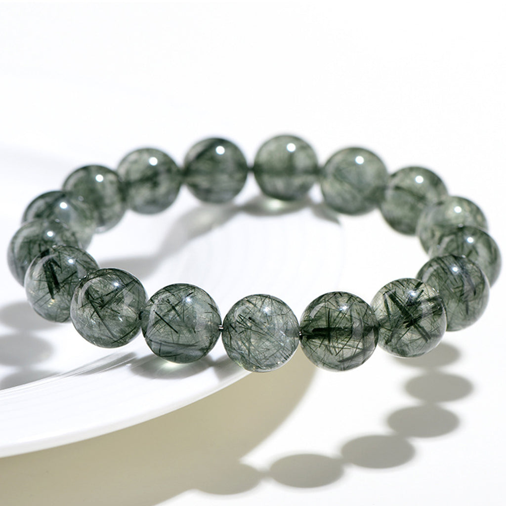 Greenstone beaded bracelet on a white background